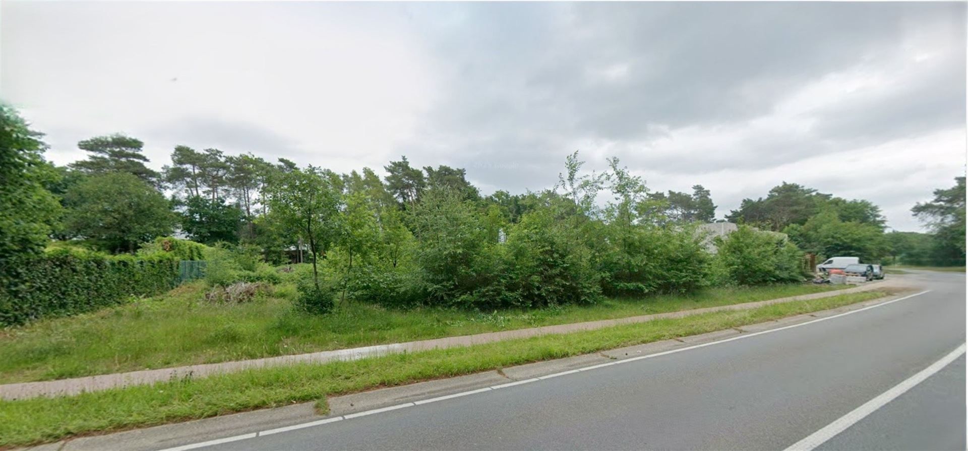 Te koop: Unieke bouwgrond van 28a22ca voor open bebouwing, straatbreedte 50m in residentiële, groene omgeving te Maasmechelen! foto 2