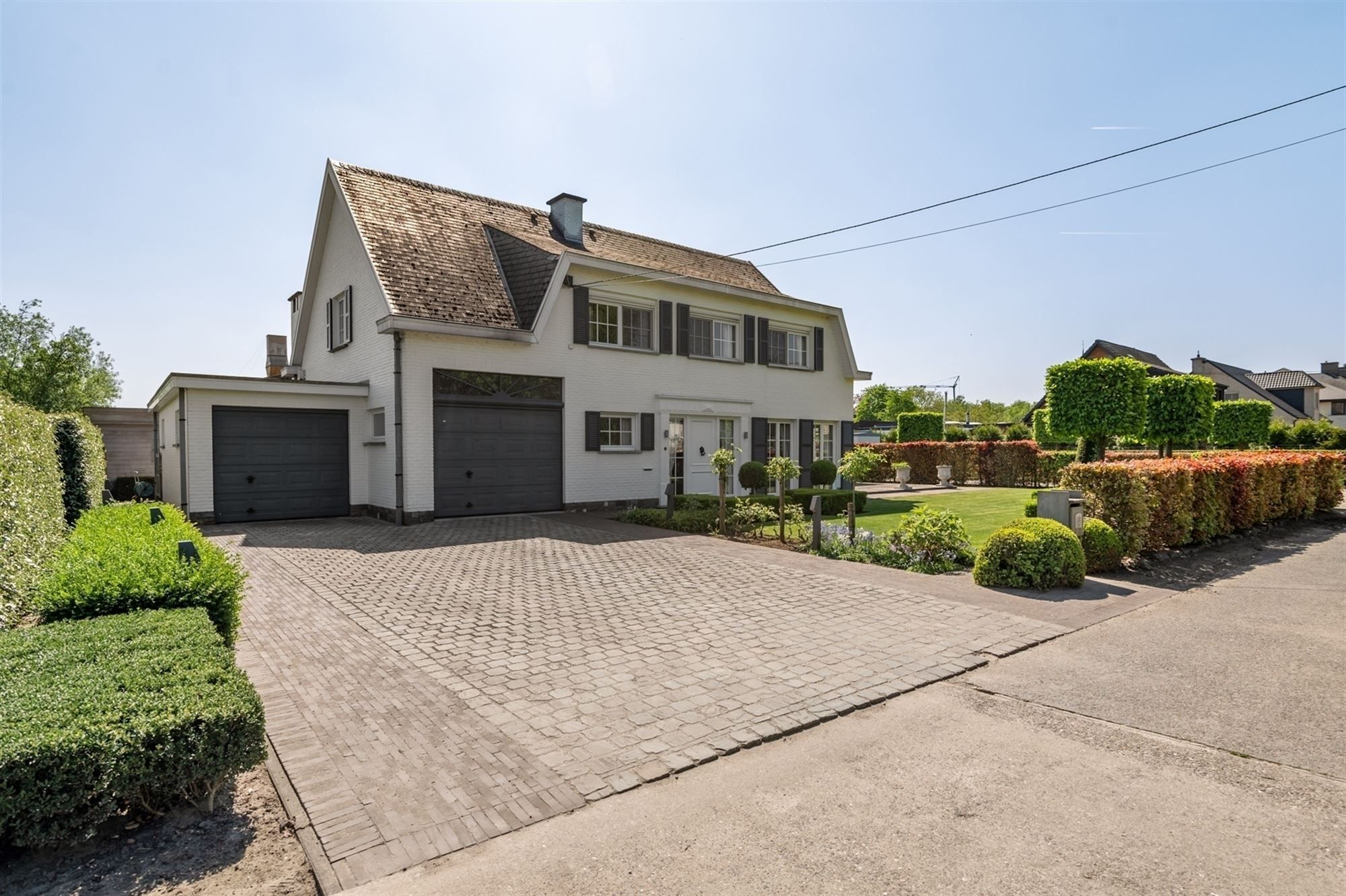 Hoofdfoto van de publicatie: Knappe bedrijfswoning met ruime loods te Onze-Lieve-Vrouw-Waver