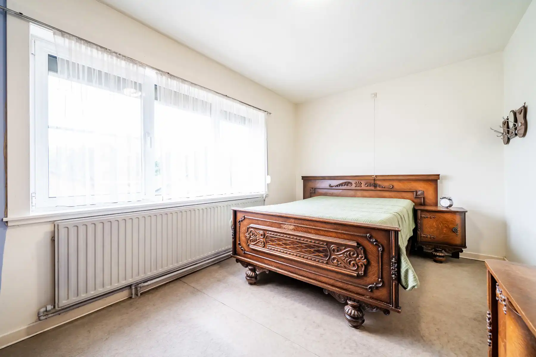 Karaktervolle jaren ’60 gezinswoning met een uitzonderlijk breed perceel (37m) en eindeloos potentieel op een toplocatie in Geel! foto 14