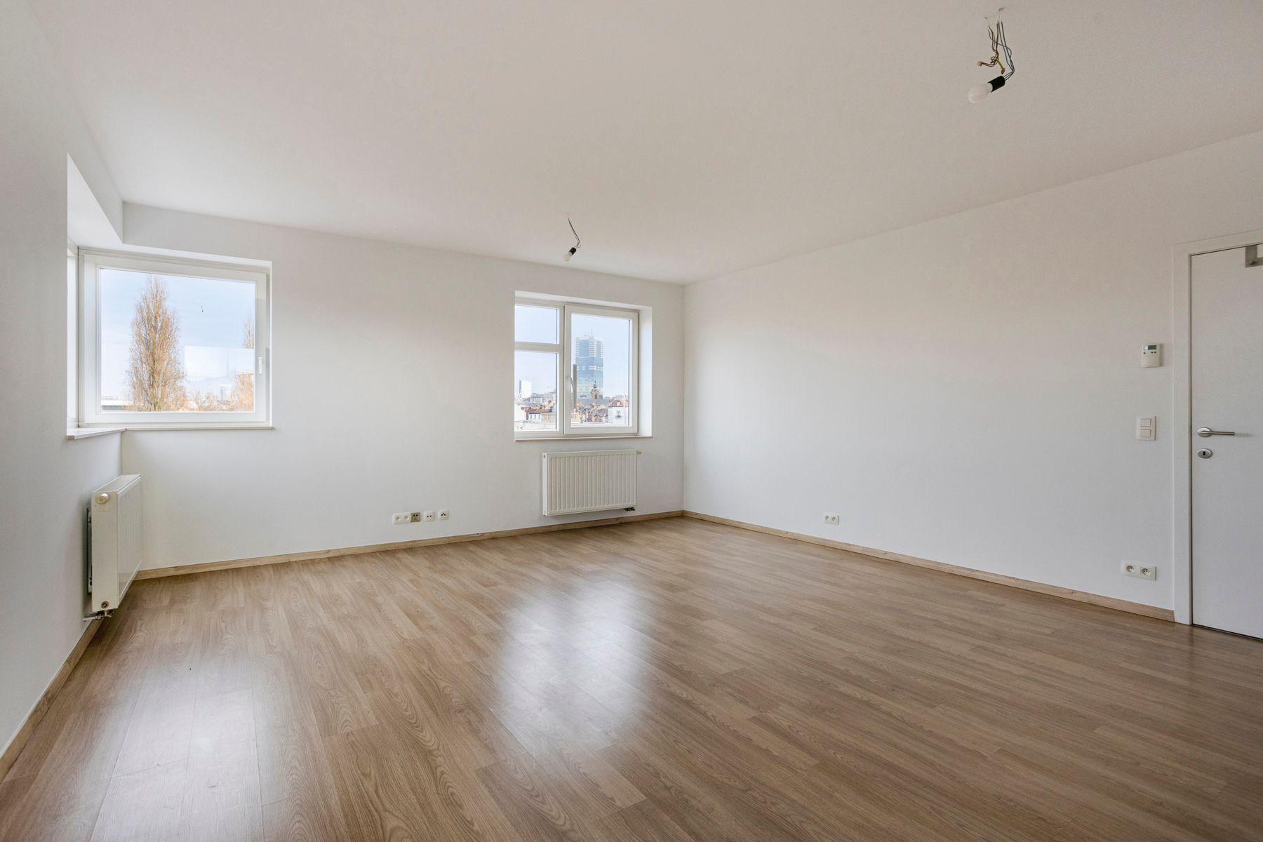 Leemans Immobiliën biedt u dit energiezuinige appartement aan met een adembenemend uitzicht over Brussel. foto 7