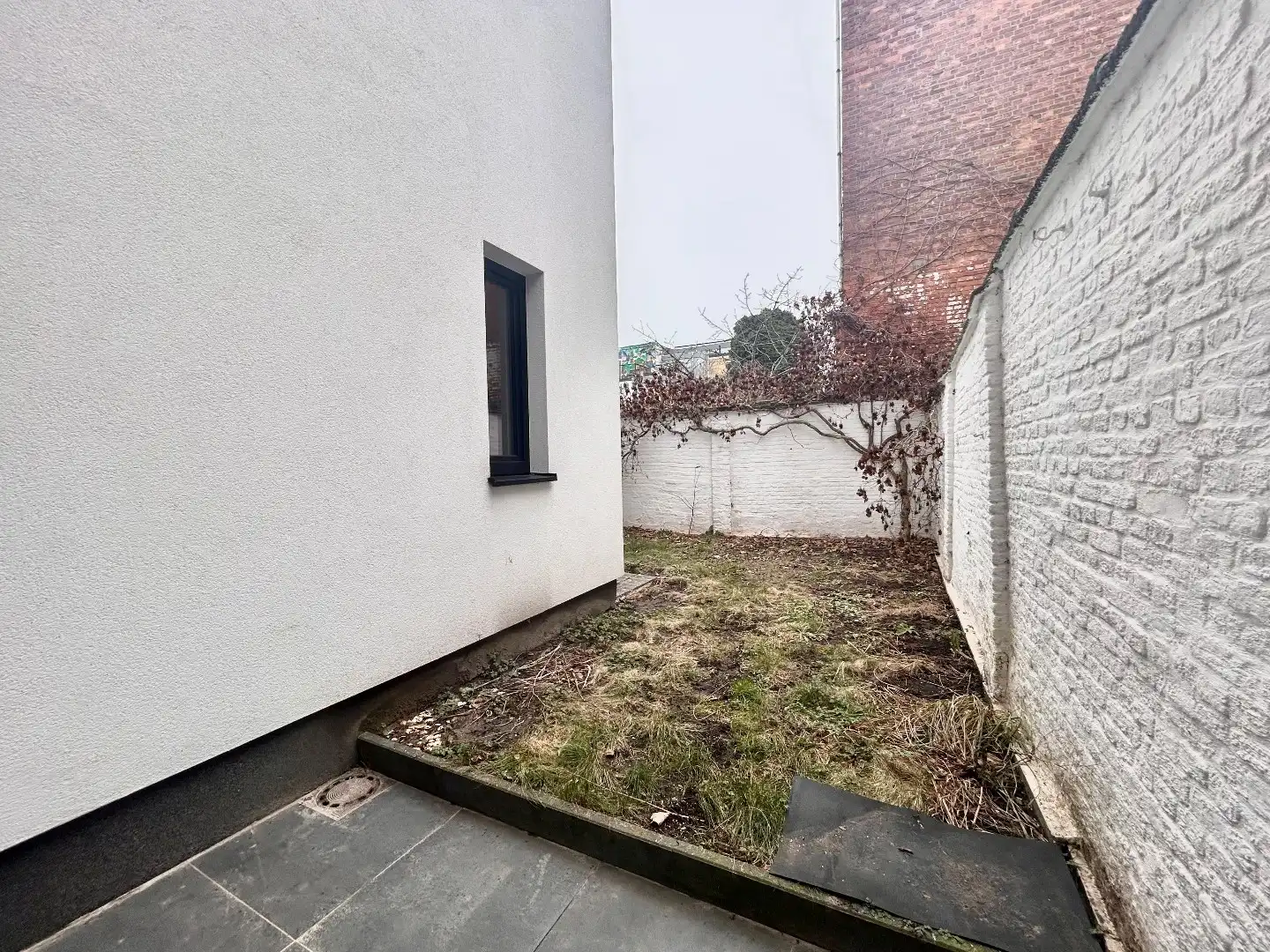 Gezellig gelijkvloers 2-slpk app met tuin. foto 12