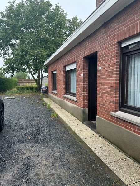 Hoofdfoto van de publicatie: Te renoveren halfopen bebouwing met tuin op een perceel van 550m²!