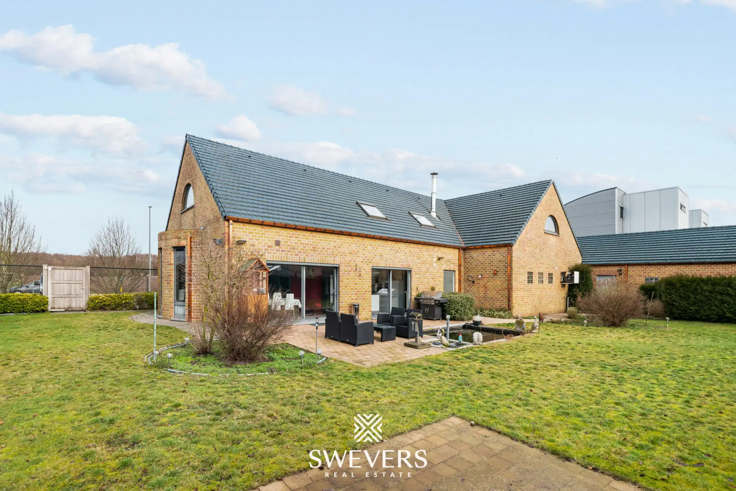 Instapklare woning met zuid gerichte tuin in Heusden-Zolder foto {{pictureIndex}}