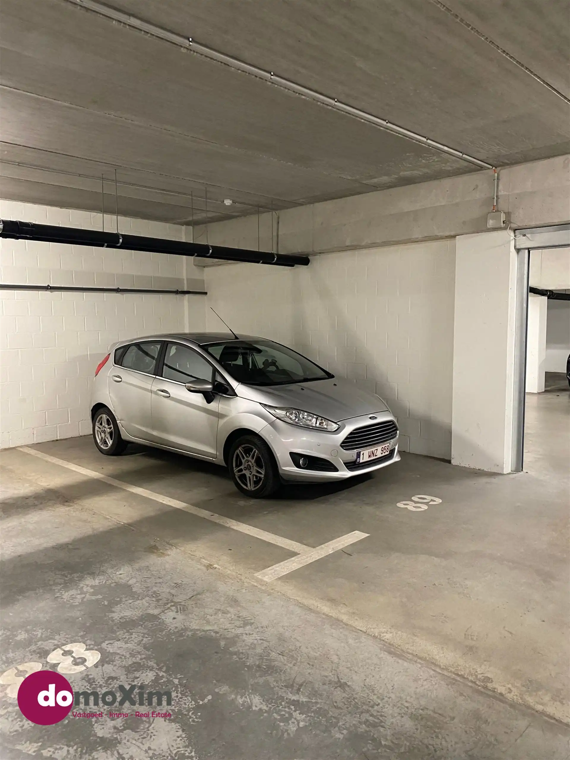 Ondergrondse parkeerplaats gelegen in het centrum van Boortmeerbeek foto {{pictureIndex}}