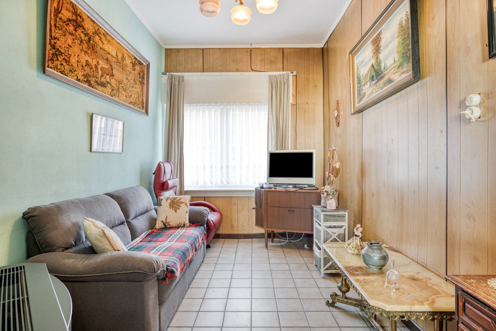 Op te knappen woning met oprit en tuin nabij de Gentbrugse Meersen foto 3