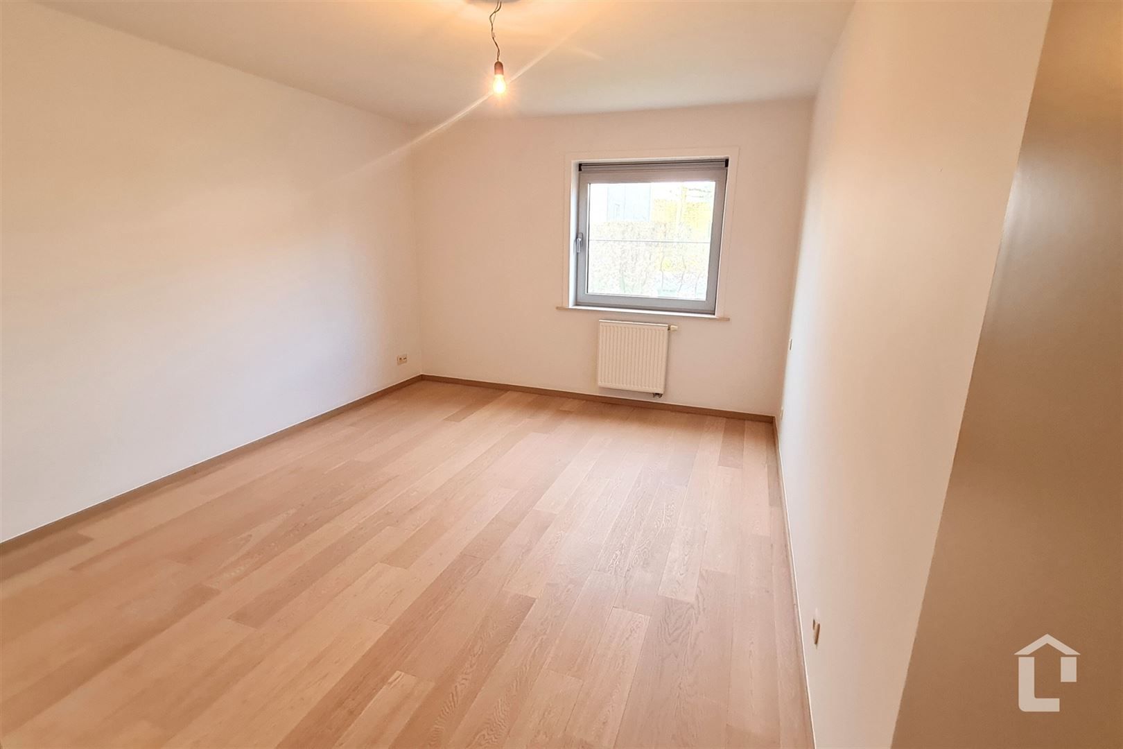 Ruim gelijkvloers appartement met eigen tuin foto 9