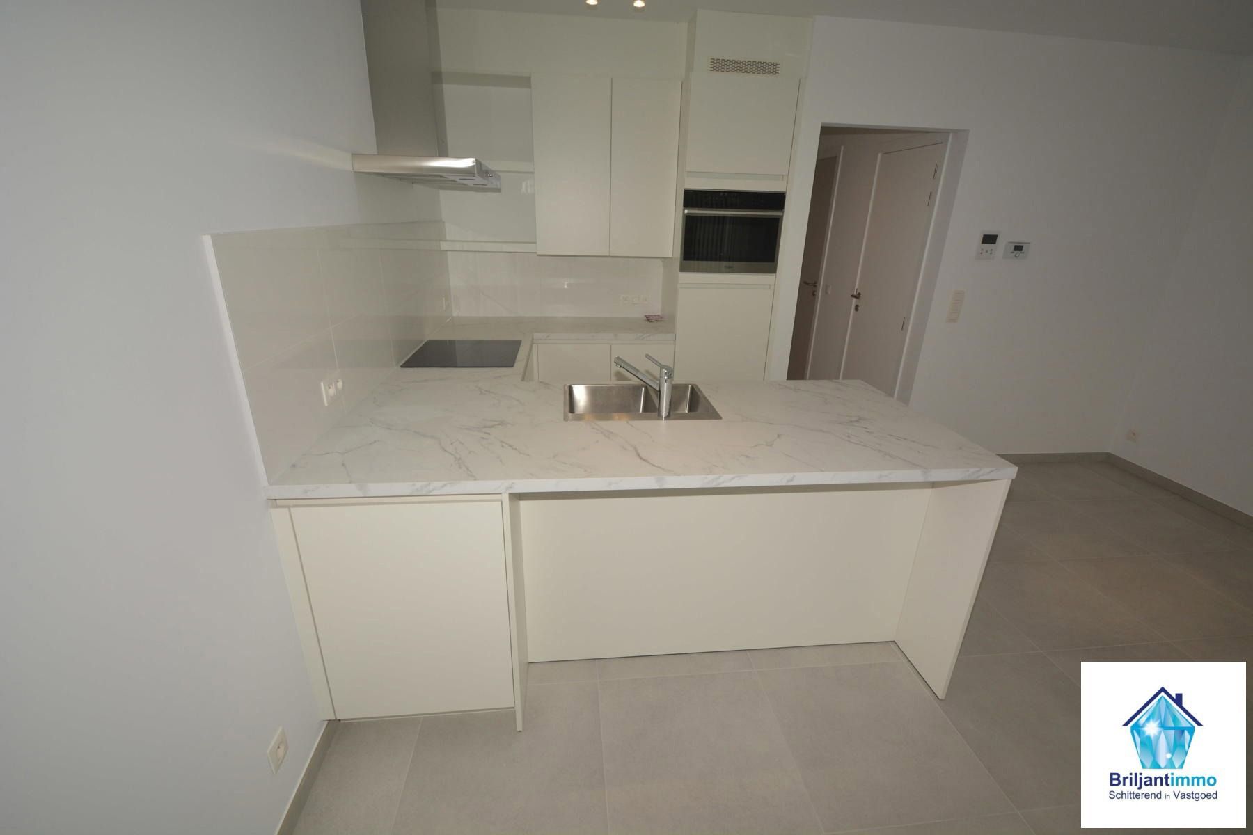 Ongelooflijk tof BEN appartement incl staanplaats en terras foto 7