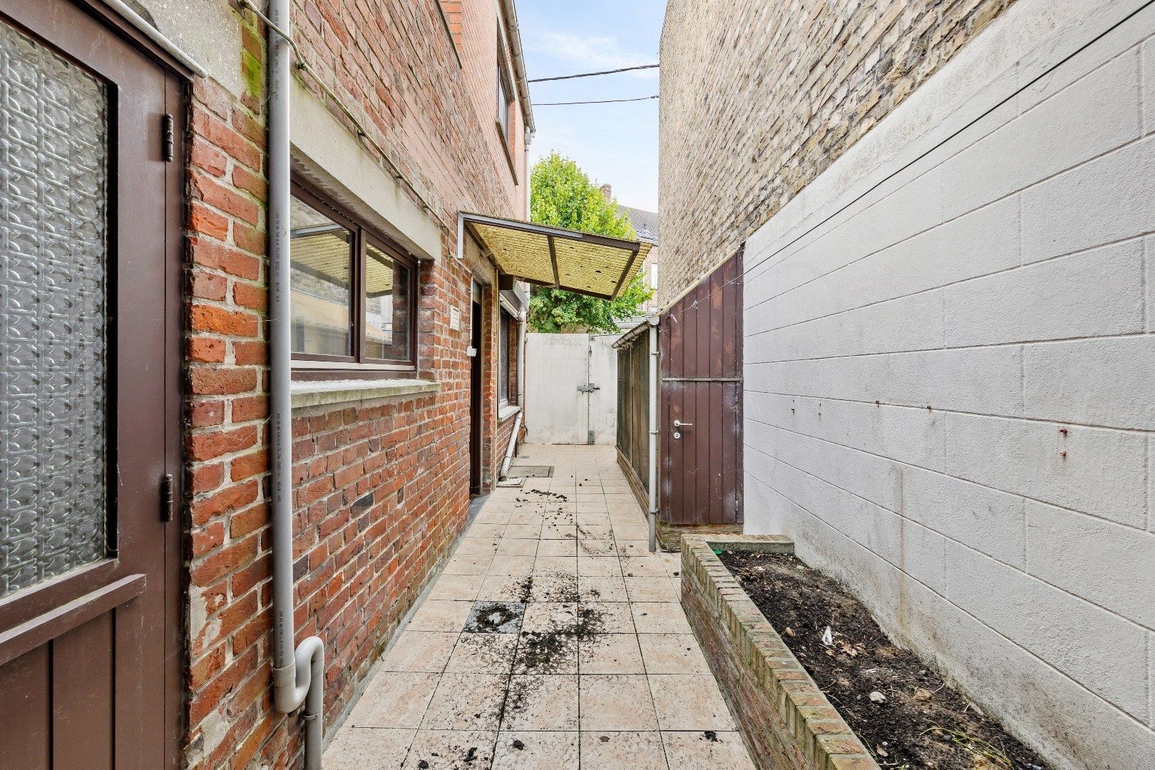 Gezellige stadswoning met 4 slaapkamers, ruime garage en koertje. foto 15