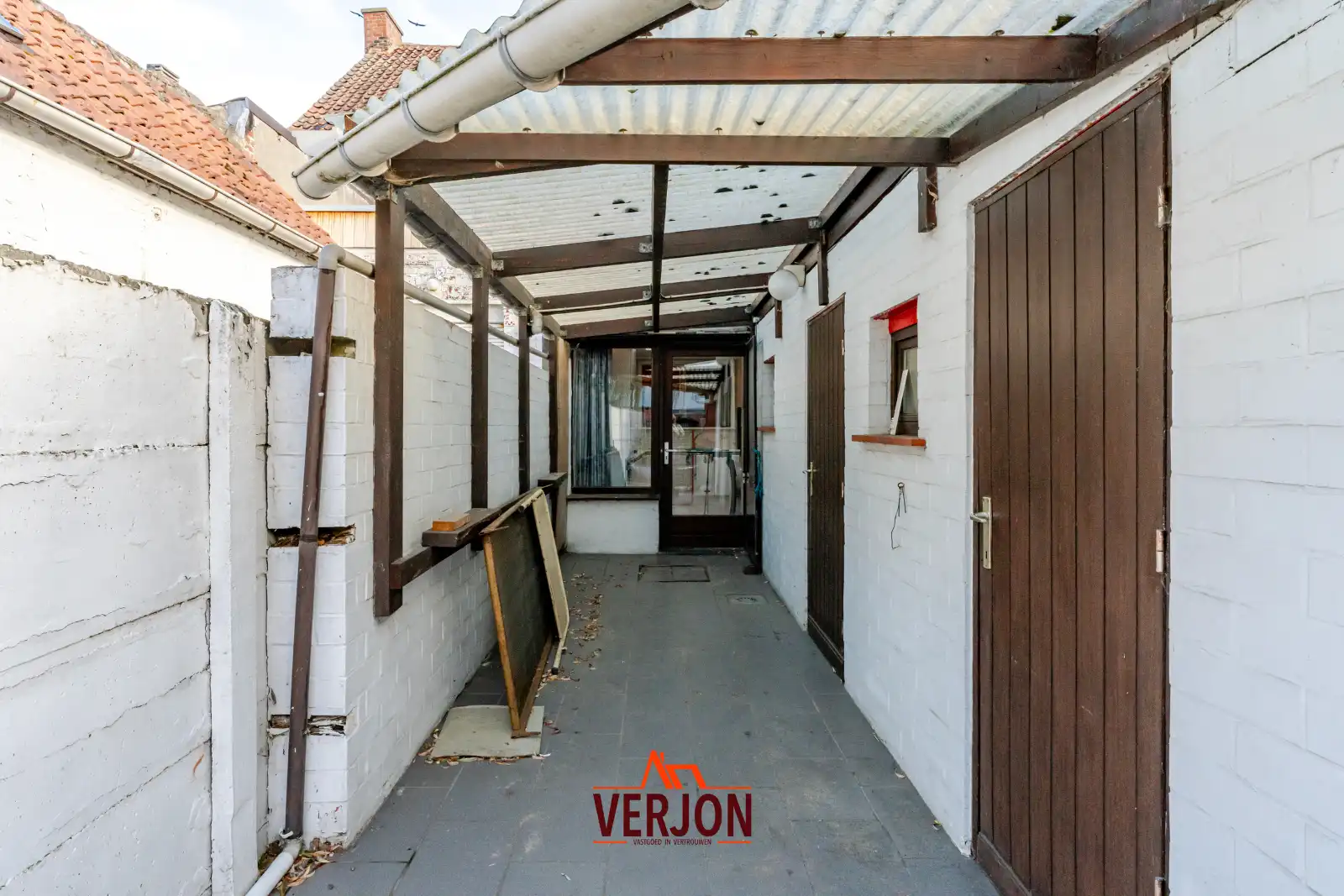 Charmante woning met ruime tuin te koop op het dorpsplein in Kachtem! foto 15