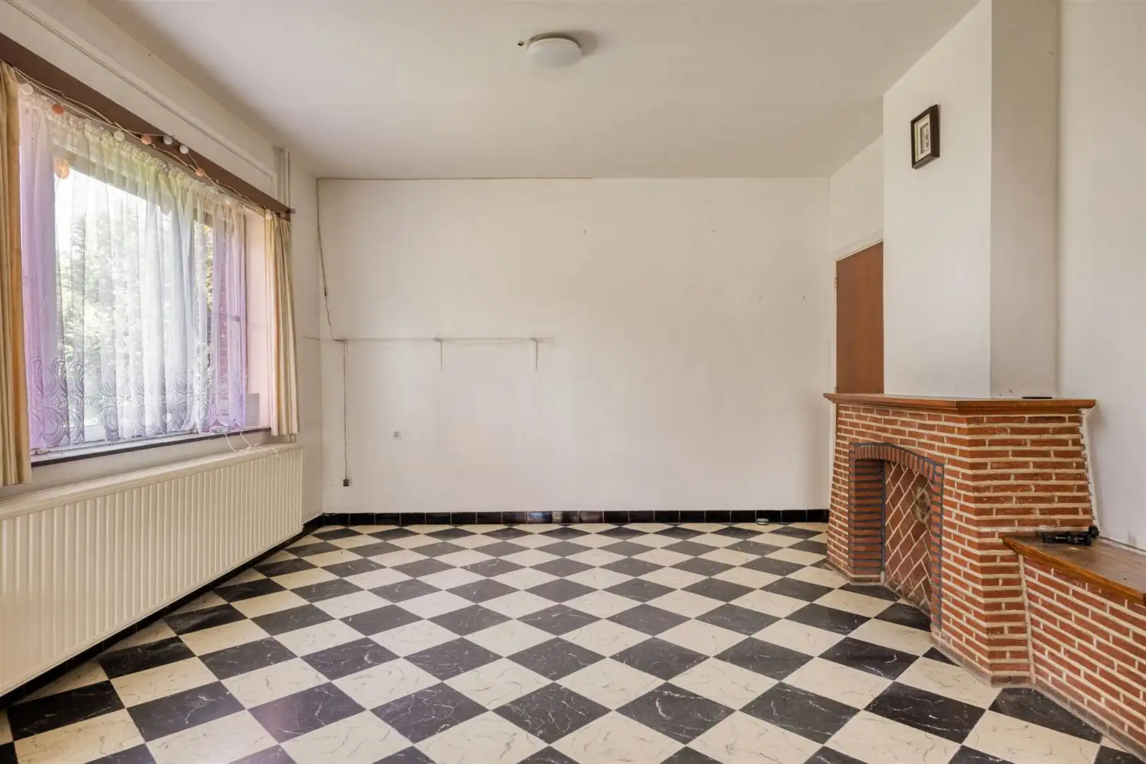 TE KOOP: Te renoveren woning met ruim perceel en projectmogelijkheden in Lummen! foto 7