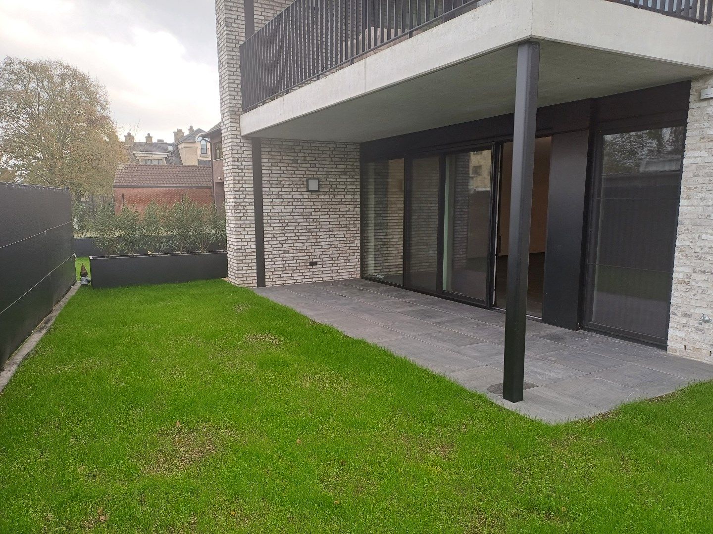 Instapklaar gelijkvloers appartement in Peer centrum met ruim terras + tuintje. foto 18