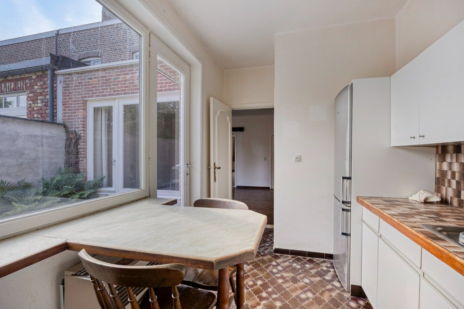 Charmante rijwoning met terras en diepe tuin aan centrum Tongeren foto 11