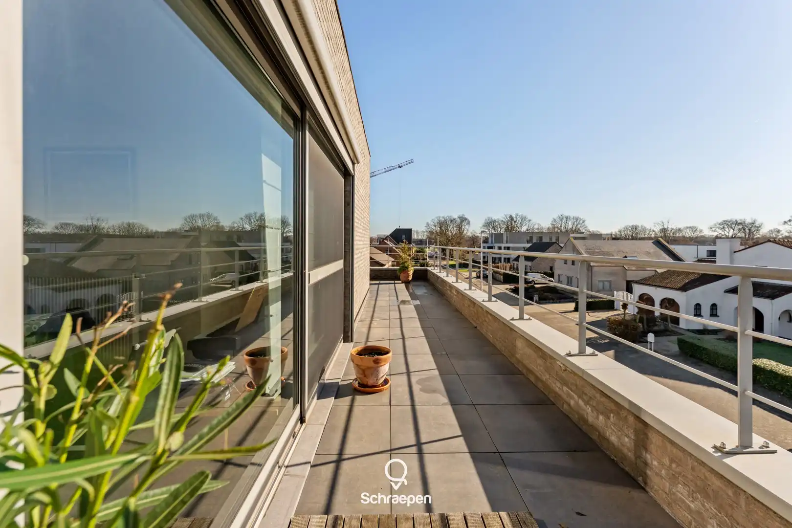 Uniek penthouse met riant zonneterras (115 m²) en 2 slpks in Zonhoven-centrum! foto 3