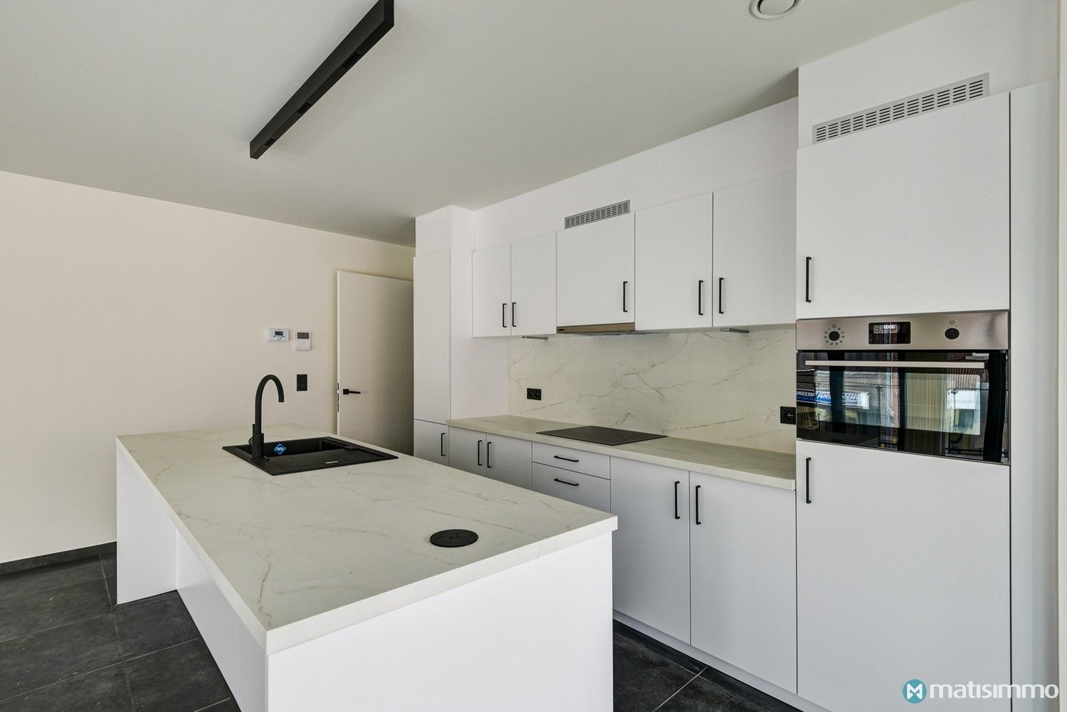 ENERGIEZUINIG APPARTEMENT MET 2 SLAAPKAMERS EN PARKEERPLAATS IN HET CENTRUM VAN BILZEN foto 4