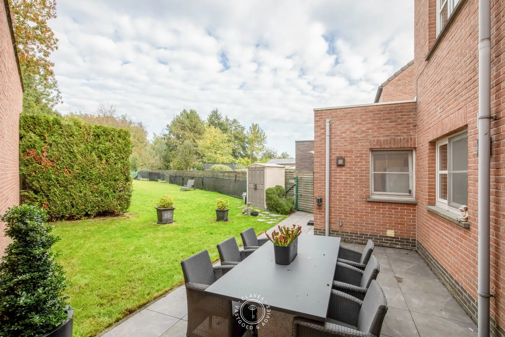 Instapklare gezinswoning met 3 slaapkamers, garage en verrassend ruime tuin in Sint-Niklaas foto 4