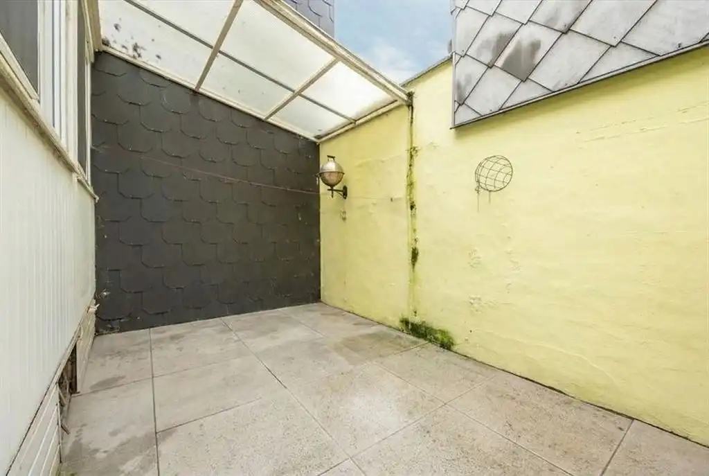 Gezellige woning met ruime garage en stadskoer foto 6