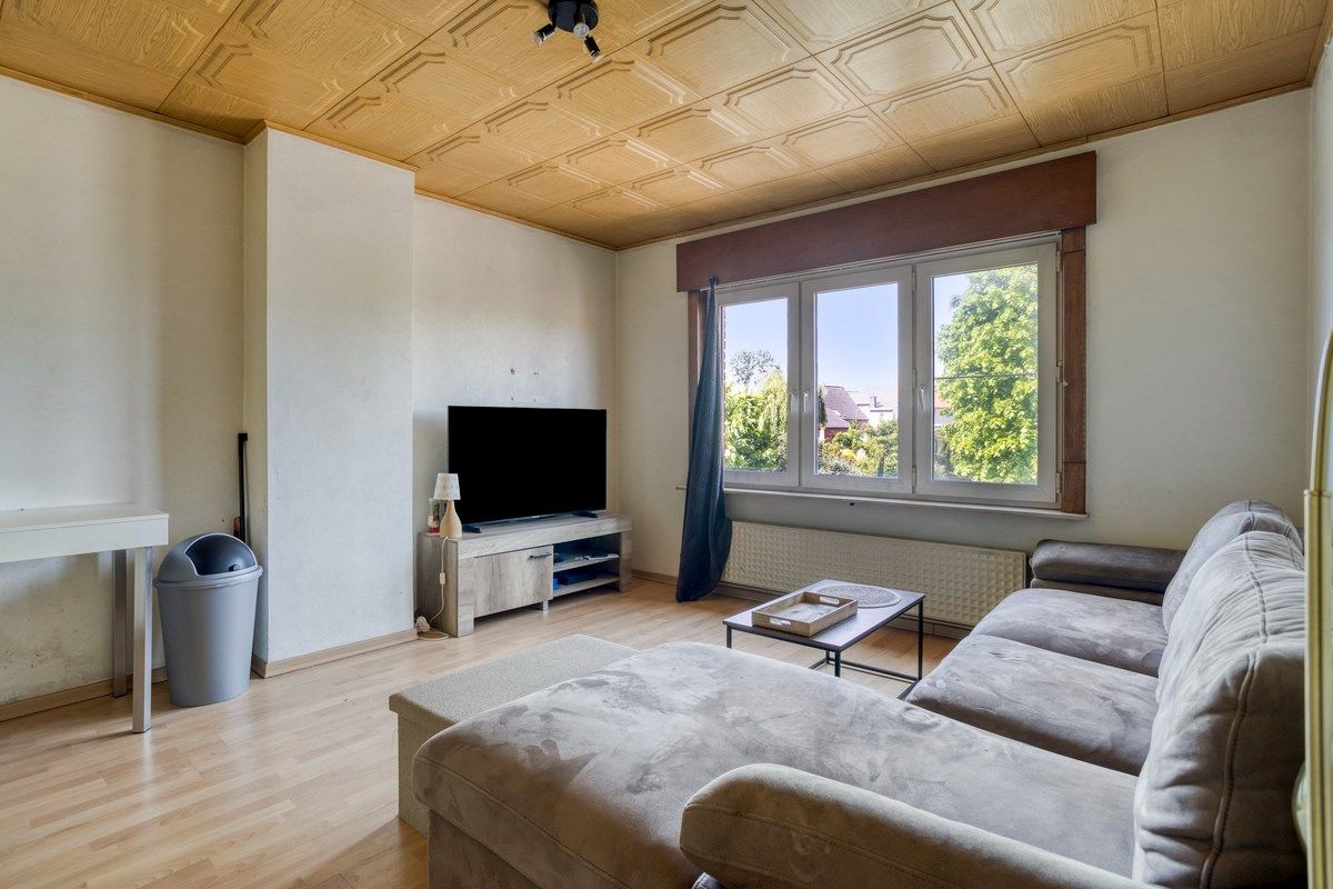 Te renoveren woning met naastliggend bouwperceel! foto 11