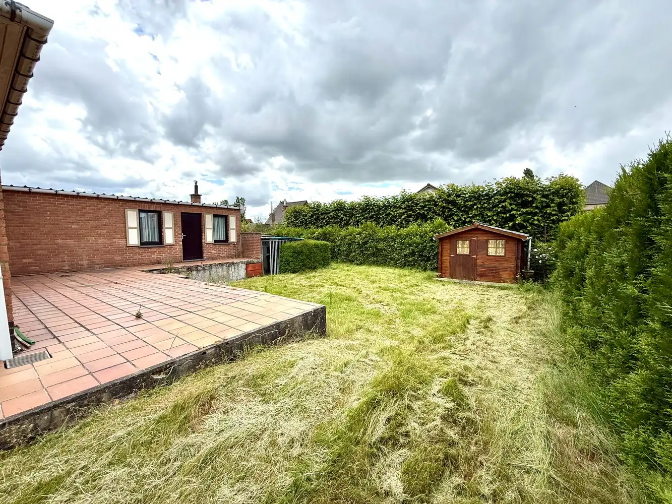 Centraal gelegen woning met veel potentieel op mooi perceel! foto 12