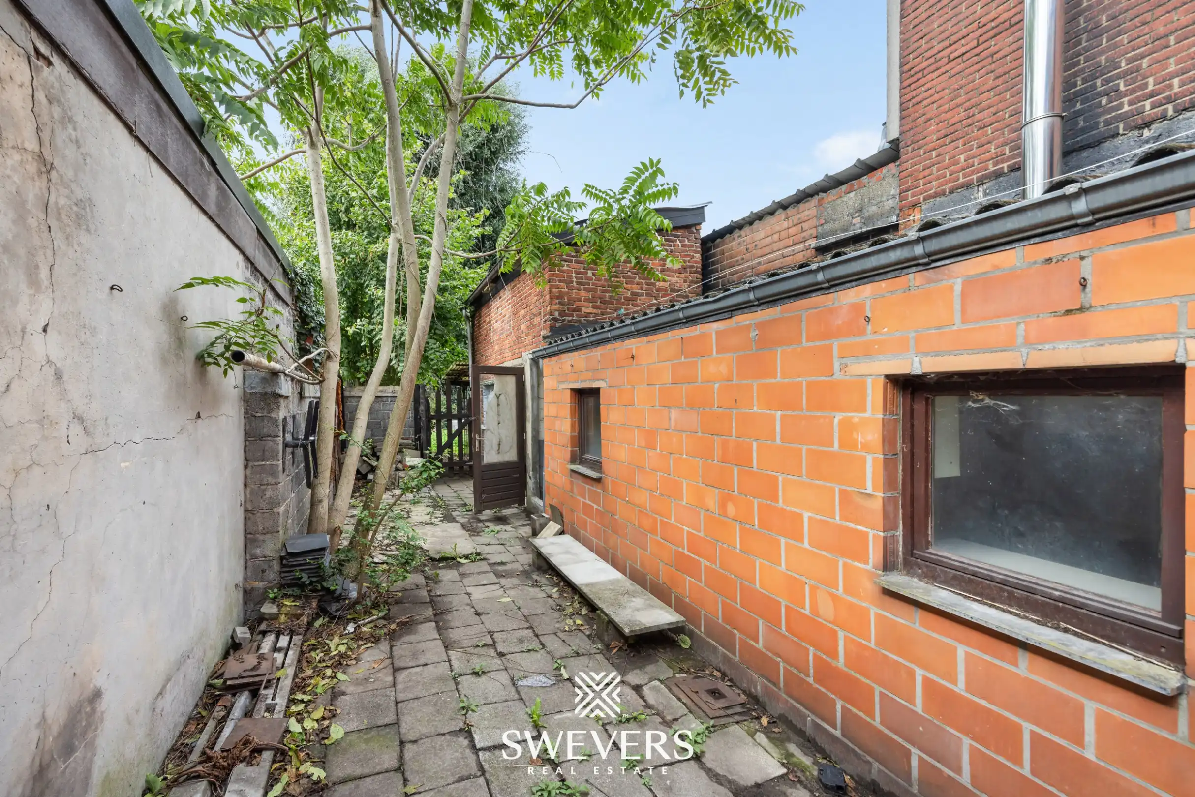 Renovatieproject met veel potentieel: karaktervolle rijwoning met tuin in de Banneuxwijk foto 21