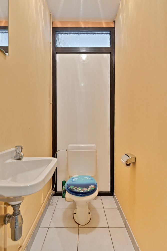 In de wijk 'Langbaanvelden' ligt deze te renoveren bel-étagewoning met 3 tot 4 slks, garage en tuin! foto 7