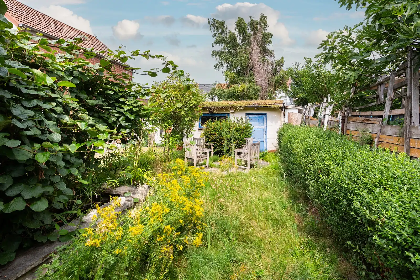 Lichtrijke bel-etagewoning met dubbele garage en ruime tuin foto 7