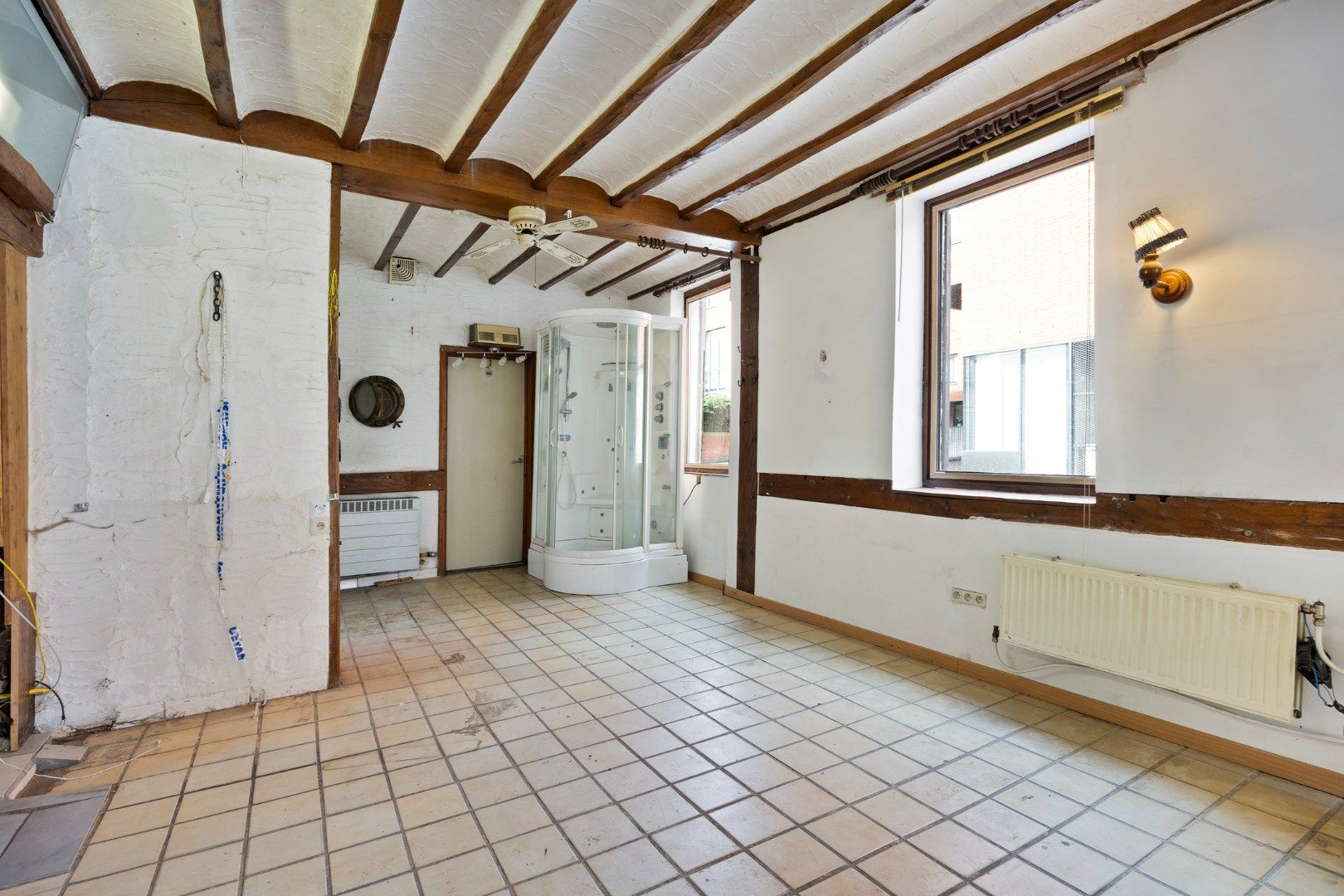 Halfopen hoekwoning met garage en dakterras op toplocatie in Kessel-Lo – renovatieproject met veel potentieel foto 5