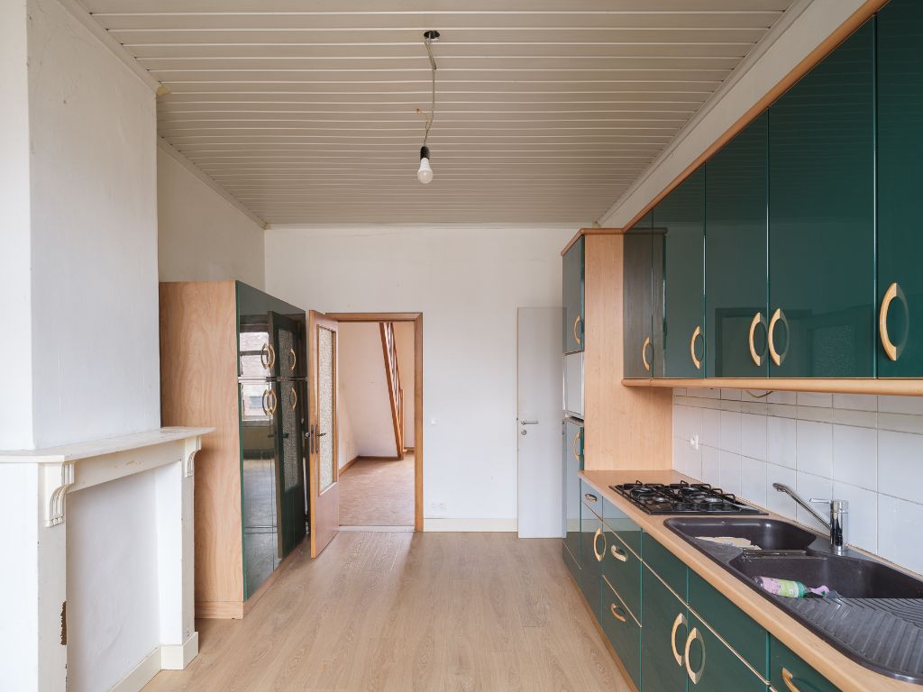 Te renoveren woning met atelier/loods, ruime tuin en bijzonder veel potentieel op een boogscheut van het stadscentrum. foto 11