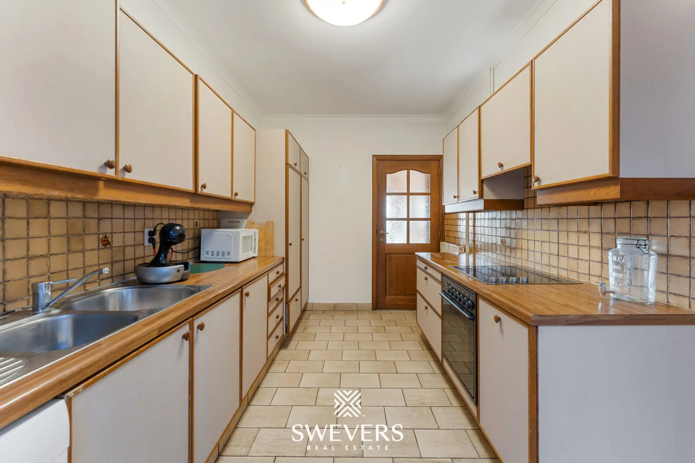 Te renoveren woning met 4 slaapkamers, grote tuin en omliggende velden op rustige ligging nabij centrum Diepenbeek foto 12