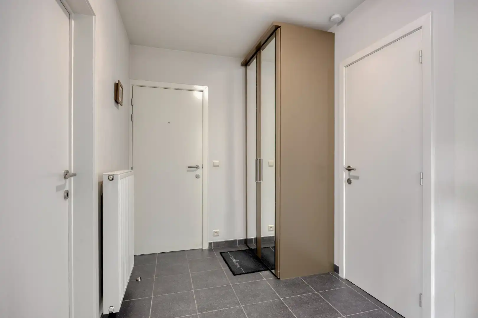 Gelijkvloers appartement met 2 slpk, 2 parkings en 2 kelderbergingen. foto 18