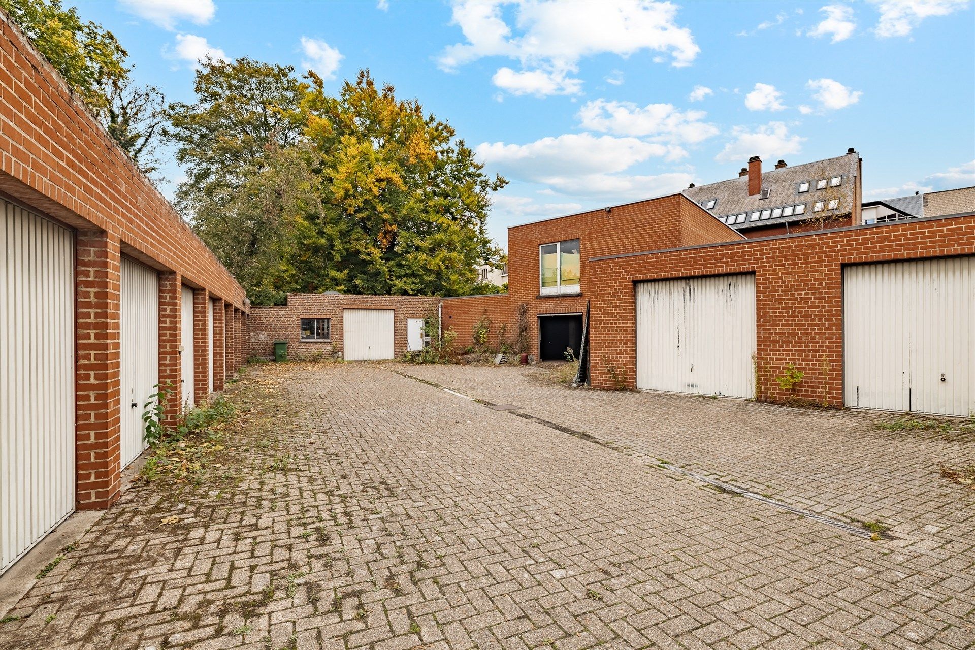 Opbrengsteigendom bestaande uit 4 appartementen + 22 garageboxen + magazijn/werkplaats foto 23