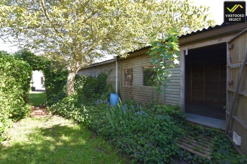 Vastgoed Select: Halfopen bebouwing met zonnige tuin, garage en renovatiepotentieel in Eeklo foto 11