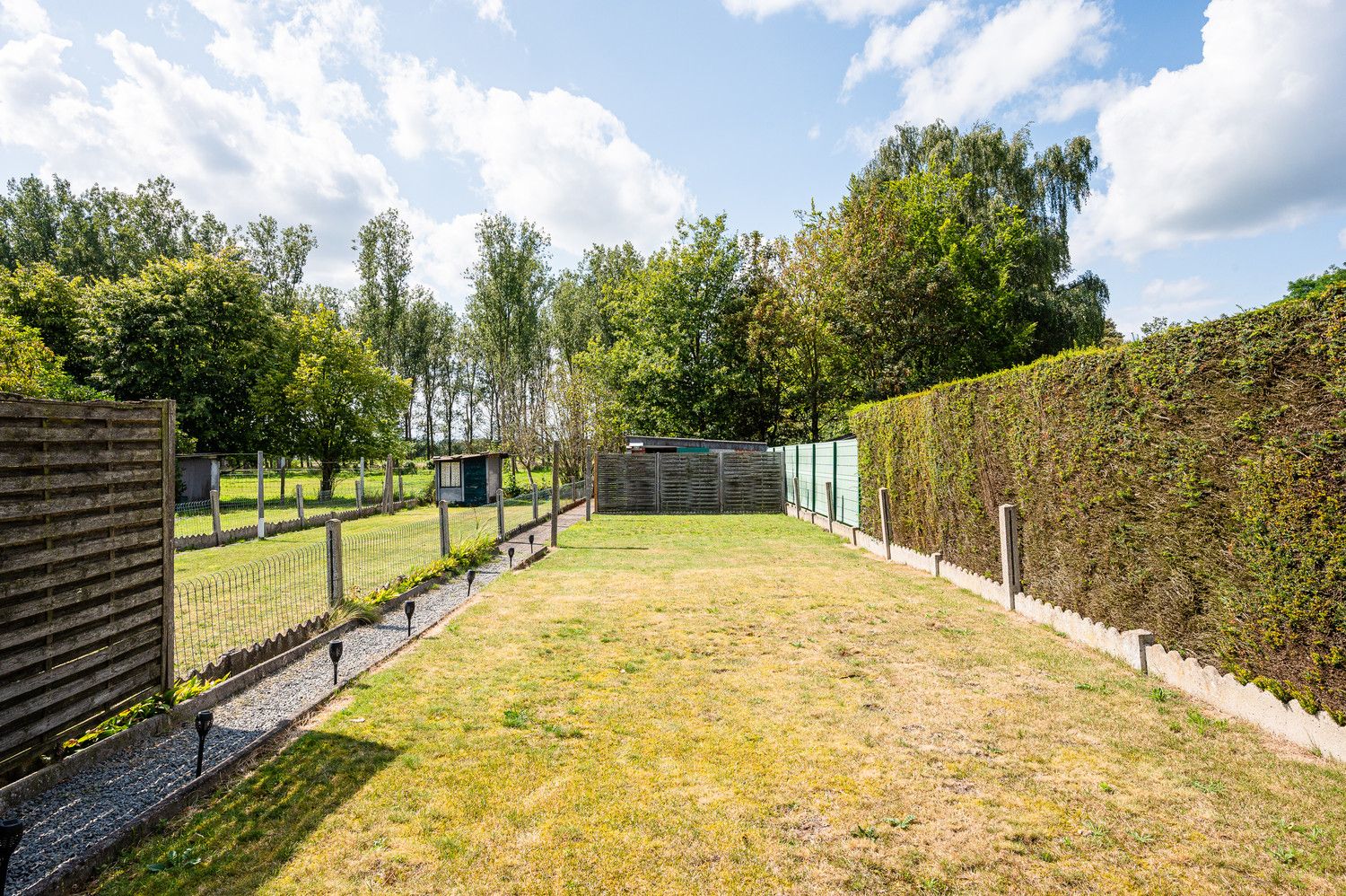 Verrassend ruime woning met prachtig zuidgerichte tuin in het Mandeweegsken! foto 17