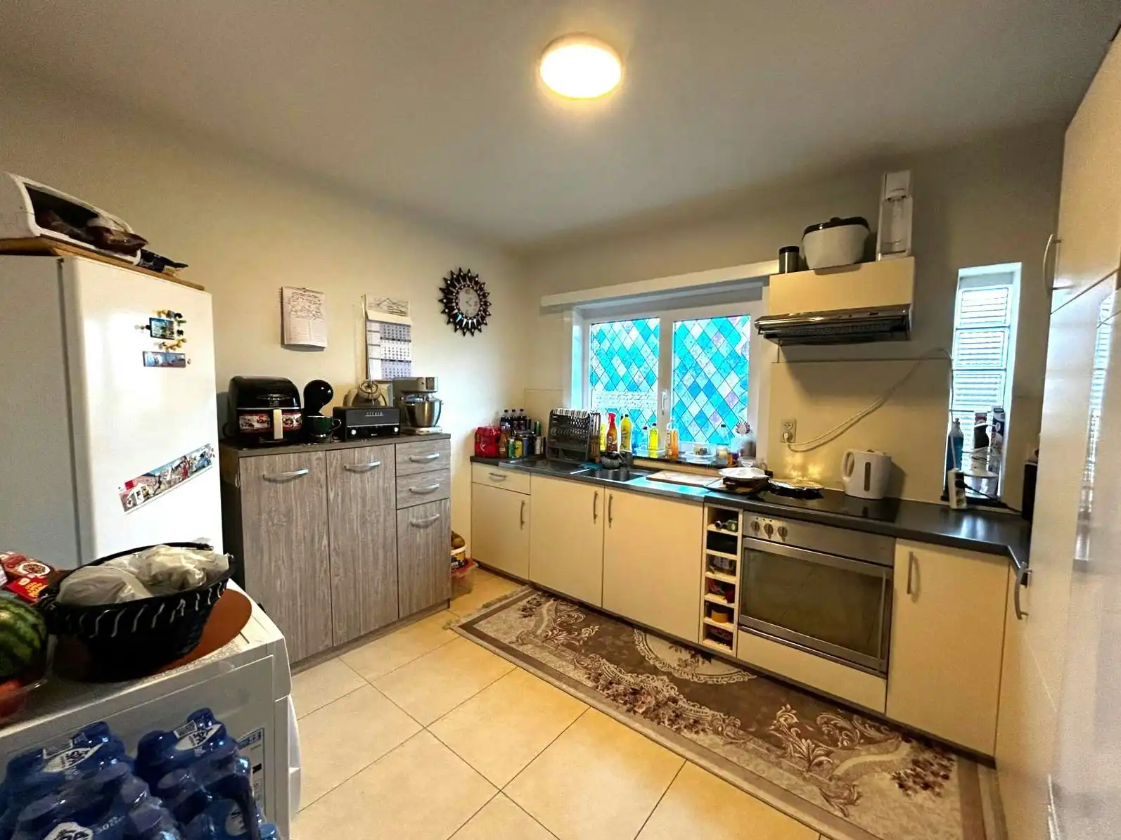 Building met twee verhuurde appartementen en 4 garages foto 14