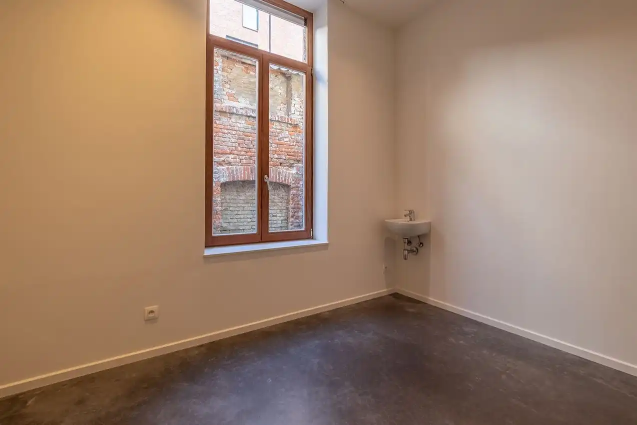 Ruim gelijkvloers appartement met zonnige tuin op toplocatie foto 20