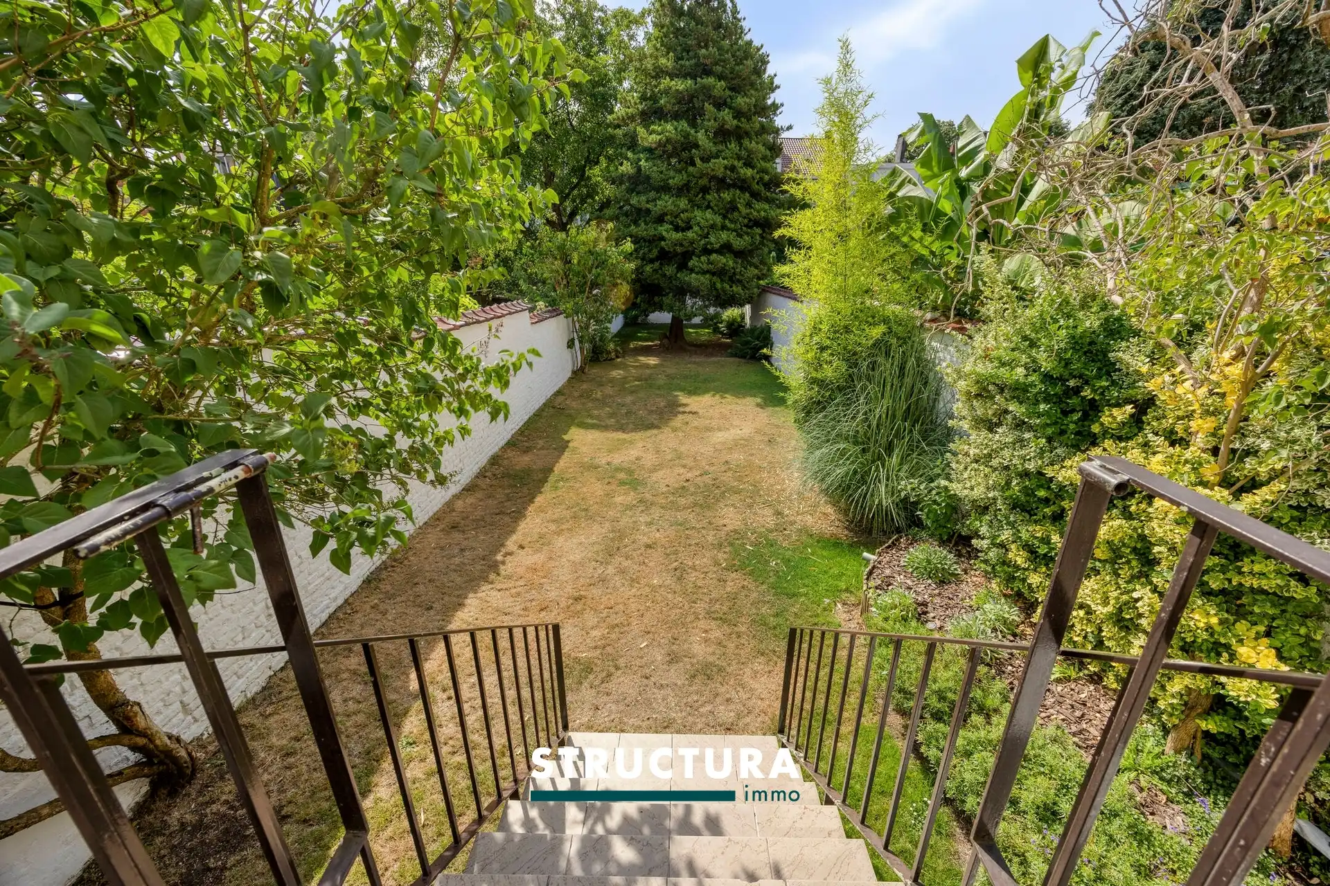 Ruime en lichtrijke woning met een aangename zuidgerichte tuin. foto 36