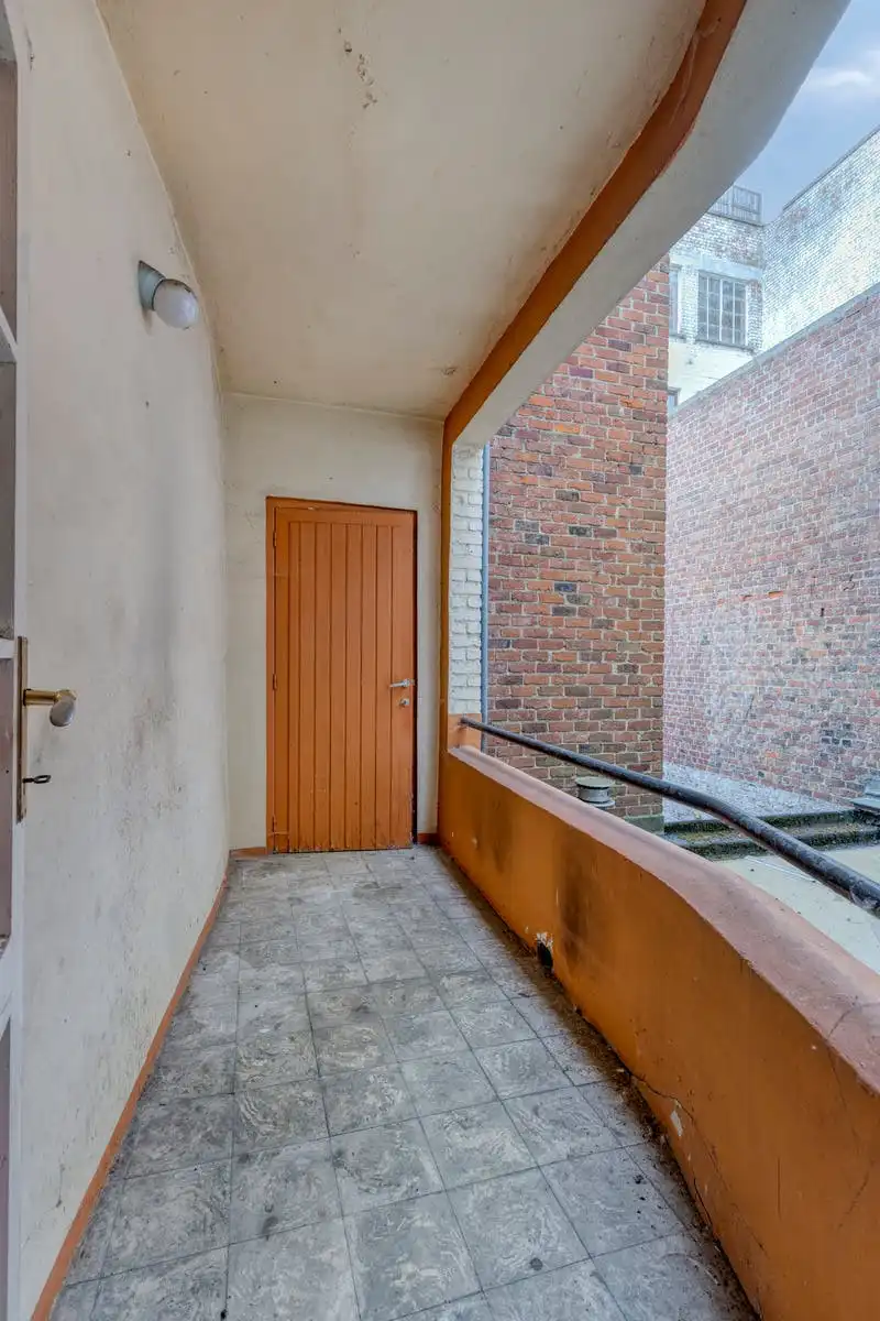 Opbrengsteigendom met renovatiepotentieel op toplocatie in Kortrijk foto 17