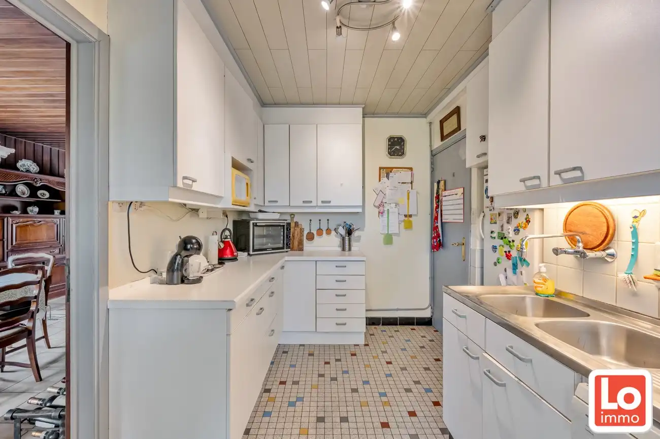 IN OPTIE! Te renoveren gelijkvloers woning met een open zicht op de achterliggende velden. foto 8