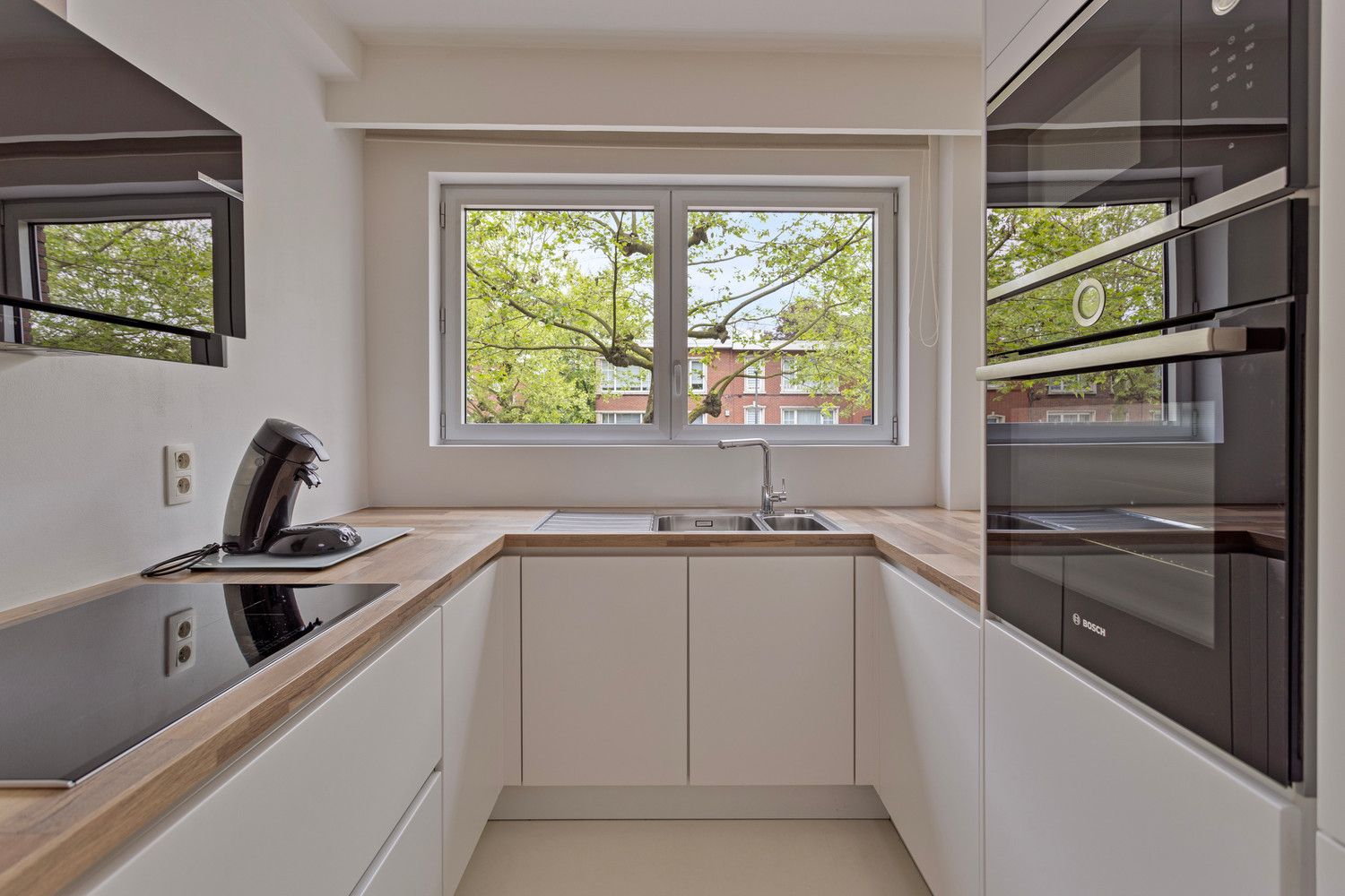 Instapklaar trendy appartement op wandelafstand van het Boekenberg Park met 3 slks, ruim terras en garagebox! foto 12