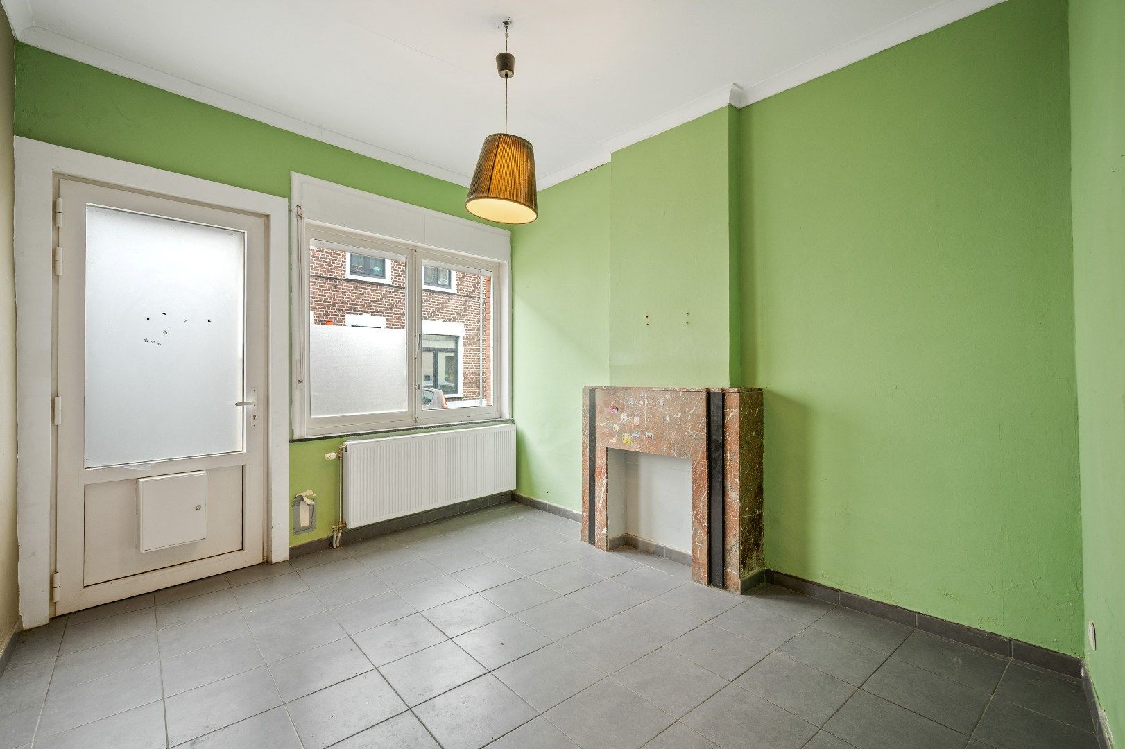 Centraal gelegen, te renoveren rijwoning nabij station foto 4