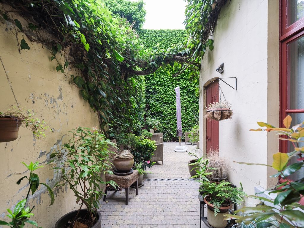 Ruime gezinswoning met een gezellige stadstuin gelegen tussen Patershol en Prinsenhof. foto 8