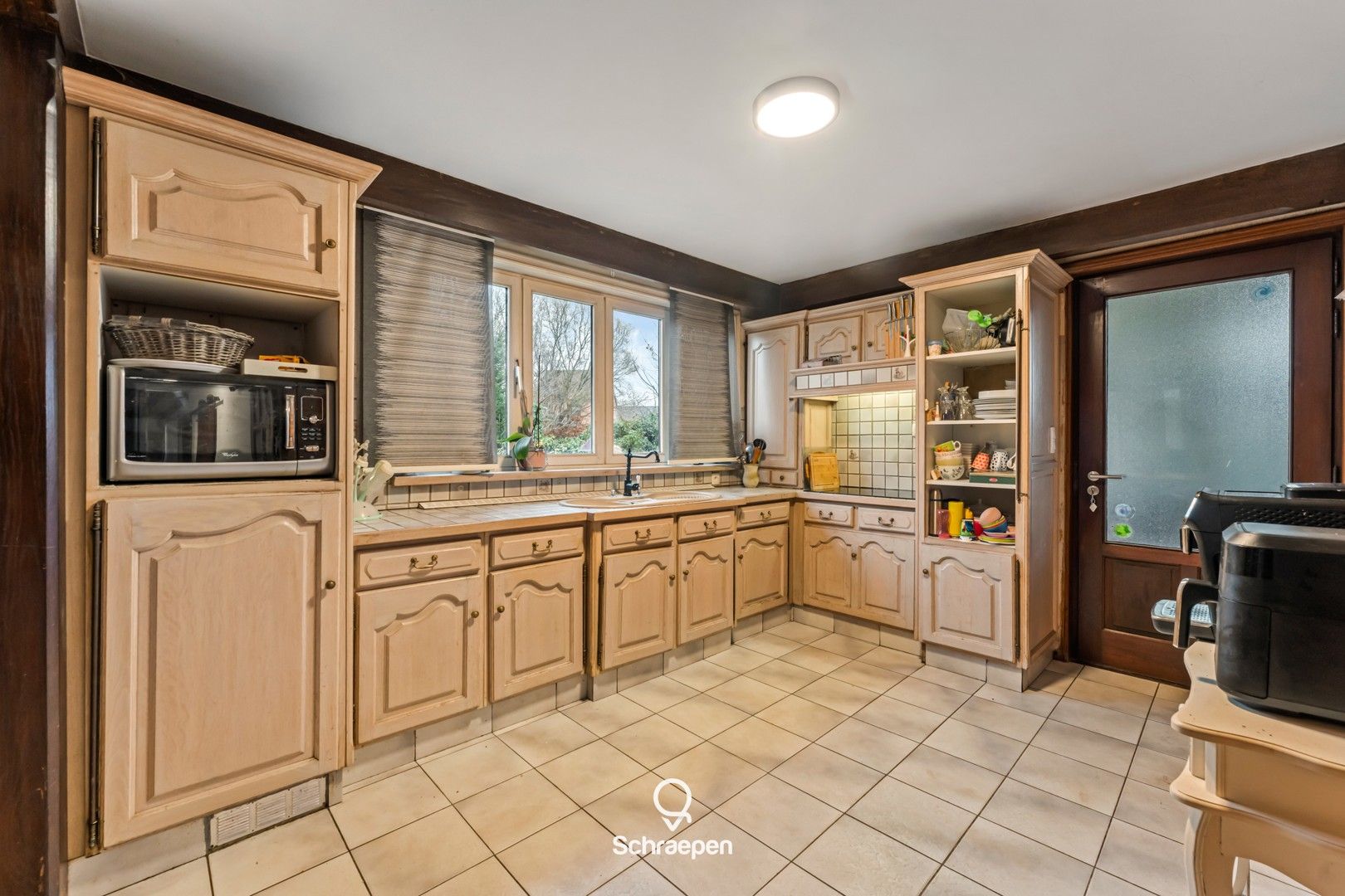 Gelijkvloerse woning op zuidoostelijk perceel van 10,5 are én straatbreedte van maar liefst 30 meter! foto 3