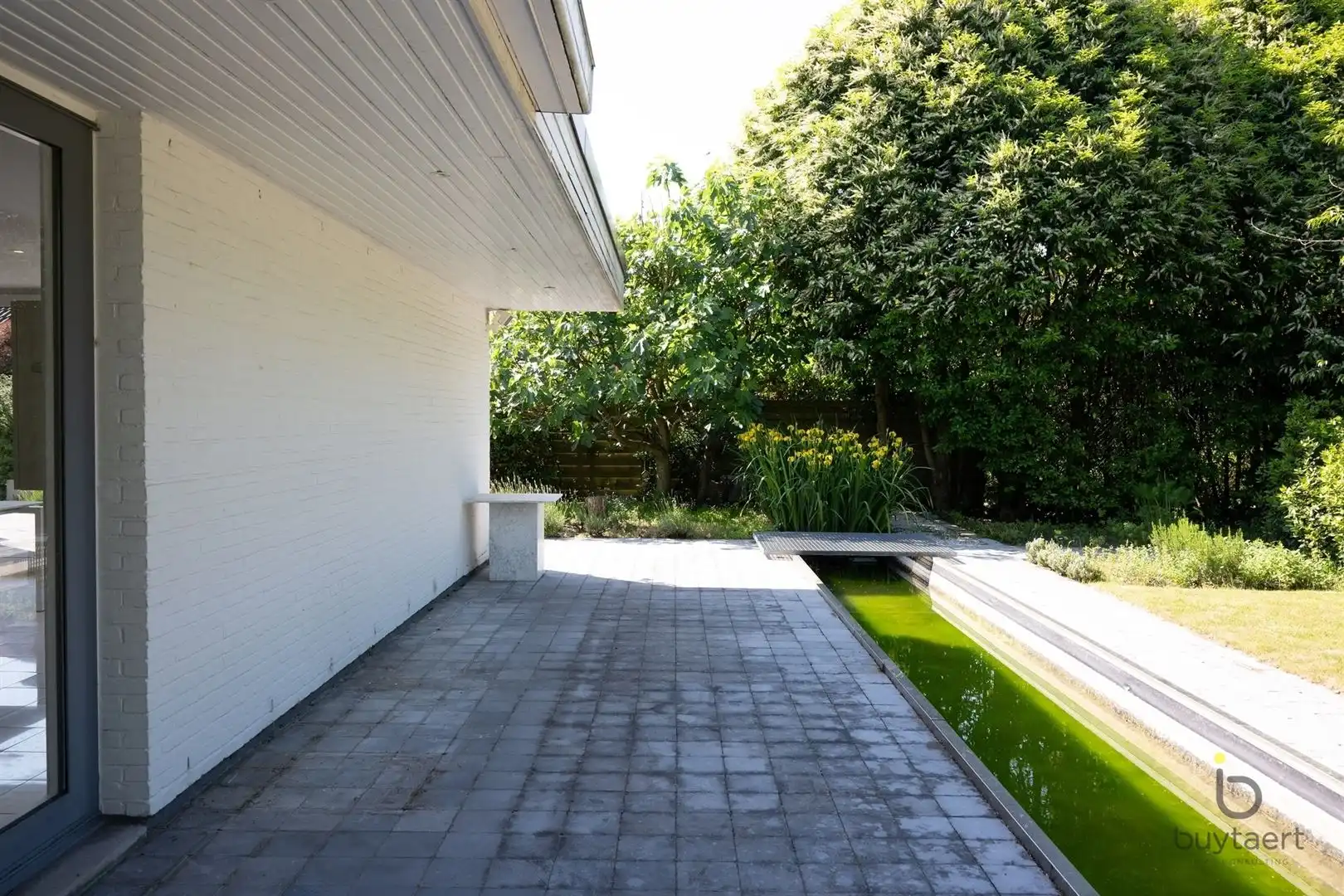Te renoveren zonovergoten gelijkvloers 70’s woning met prachtige tuin en tal van mogelijkheden! foto 43
