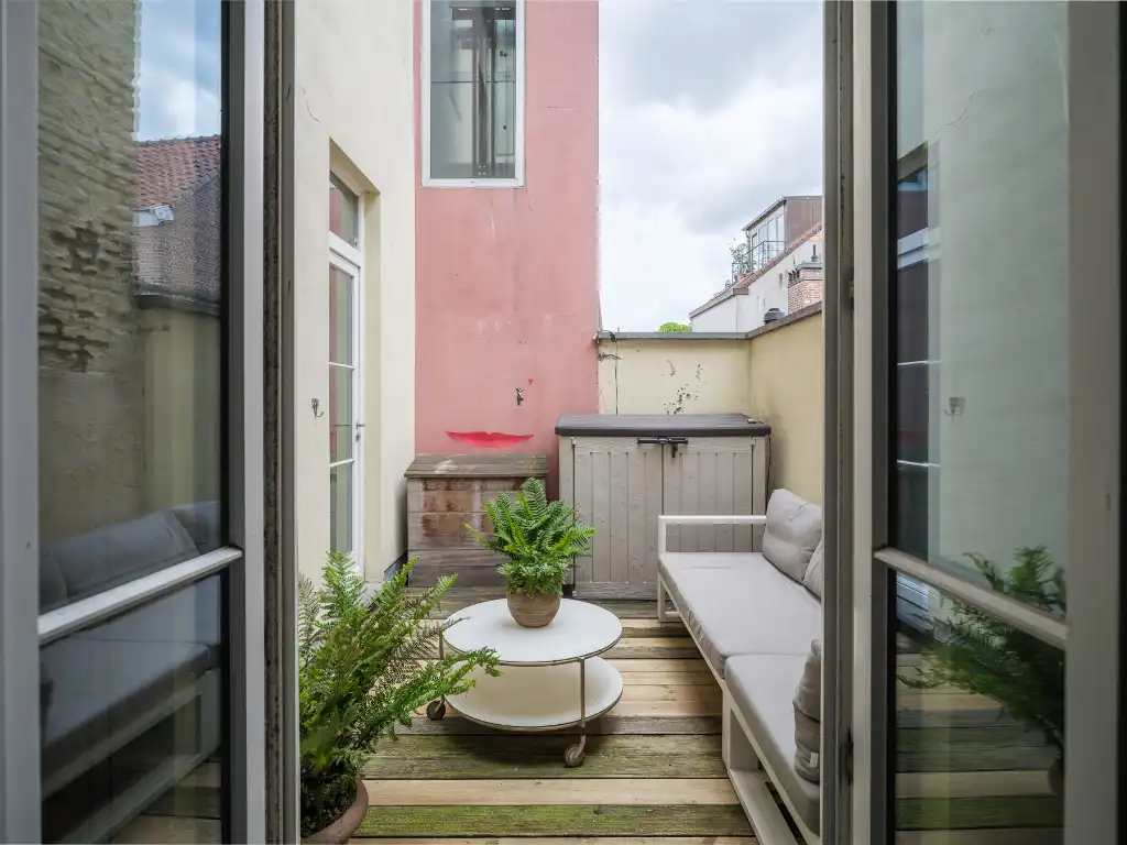 Karaktervol herenhuisappartement met terras en zicht op het stadhuis foto 11