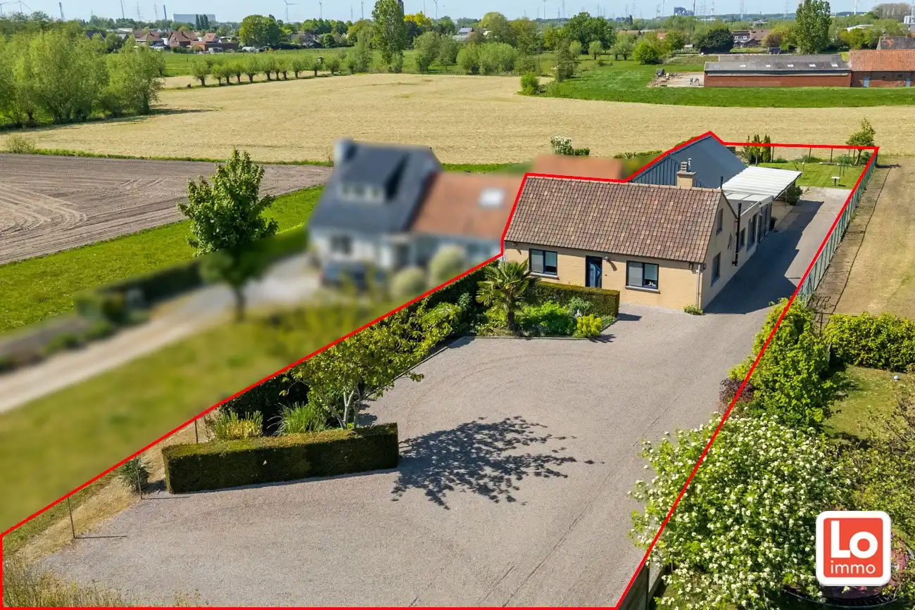 Landelijk gelegen half open woning met ruim bijgebouw (ca. 65m) en grote tuin met open zicht tussen Hijfte en Lochristi. foto 3