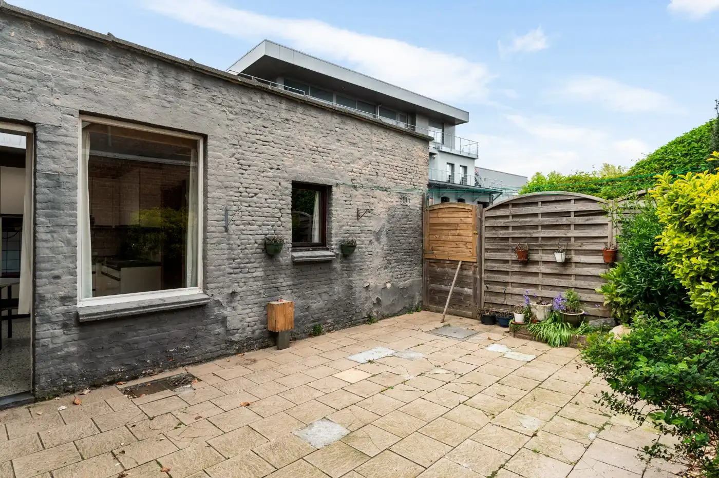 Te renoveren woning met 3 slpk., stadstuin en garage foto 22