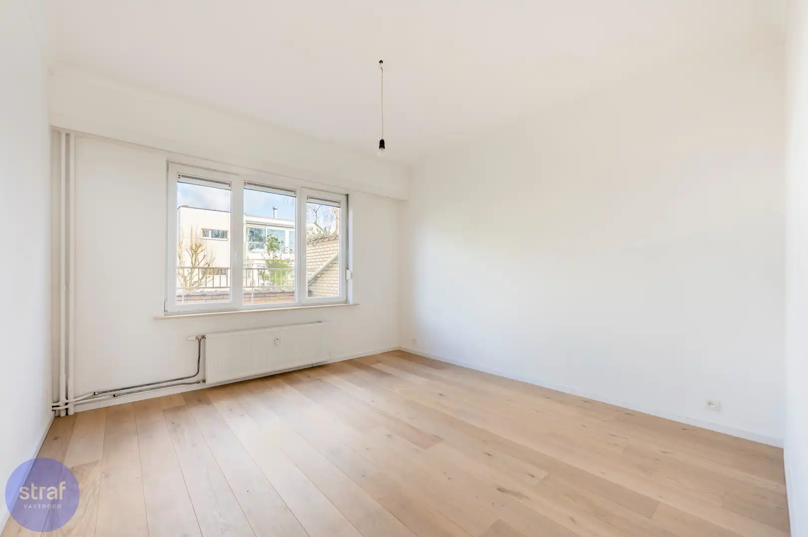 TE HUUR/ Gerenoveerd appartement met 2 slaapkamers, groot terras en zicht op het Galgenweel + 2 kelderbergingen foto 8