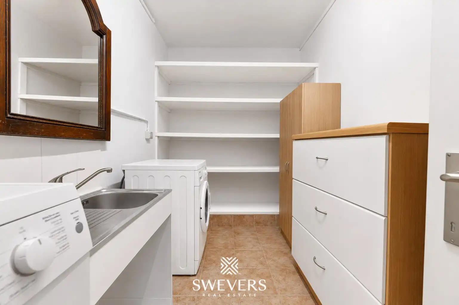 Ruim gelijkvloers appartement met twee slaapkamers foto 21
