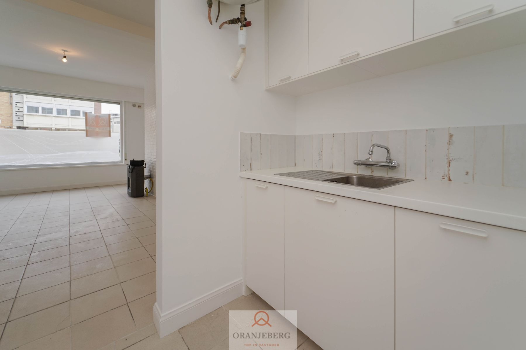 Appartement op het gelijkvloers met koertje (18 m²) te Rooigemlaan ! foto 8