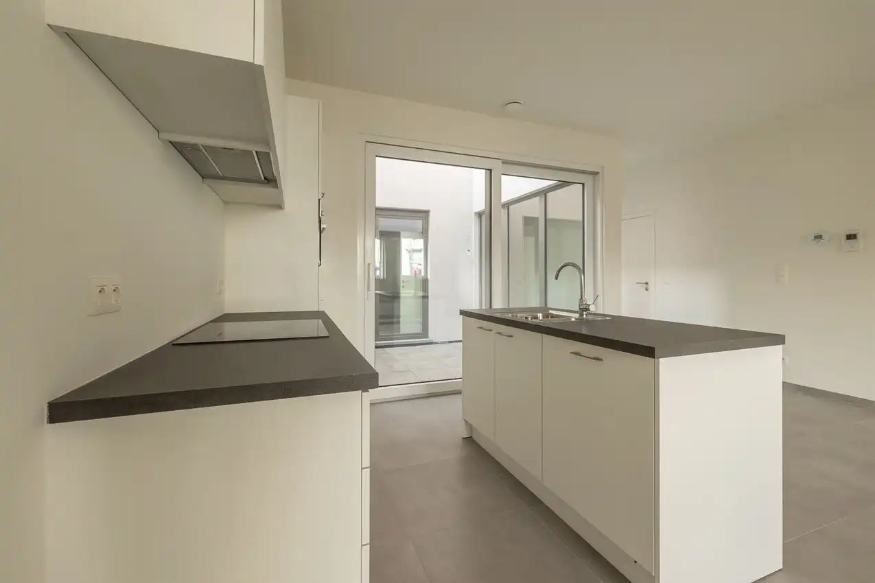 Nieuwbouwappartement met 1 slpk, autostaanplaats en terras foto 6