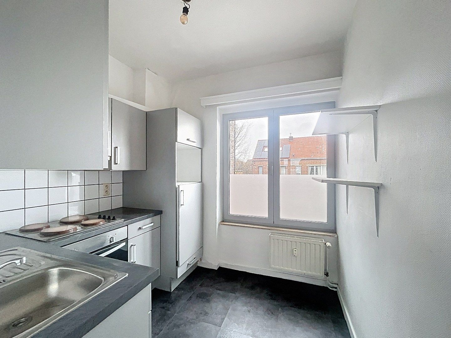 Veelzijdig pand op topligging: wonen en werken of tweewoonst met terrassen en garage foto 14